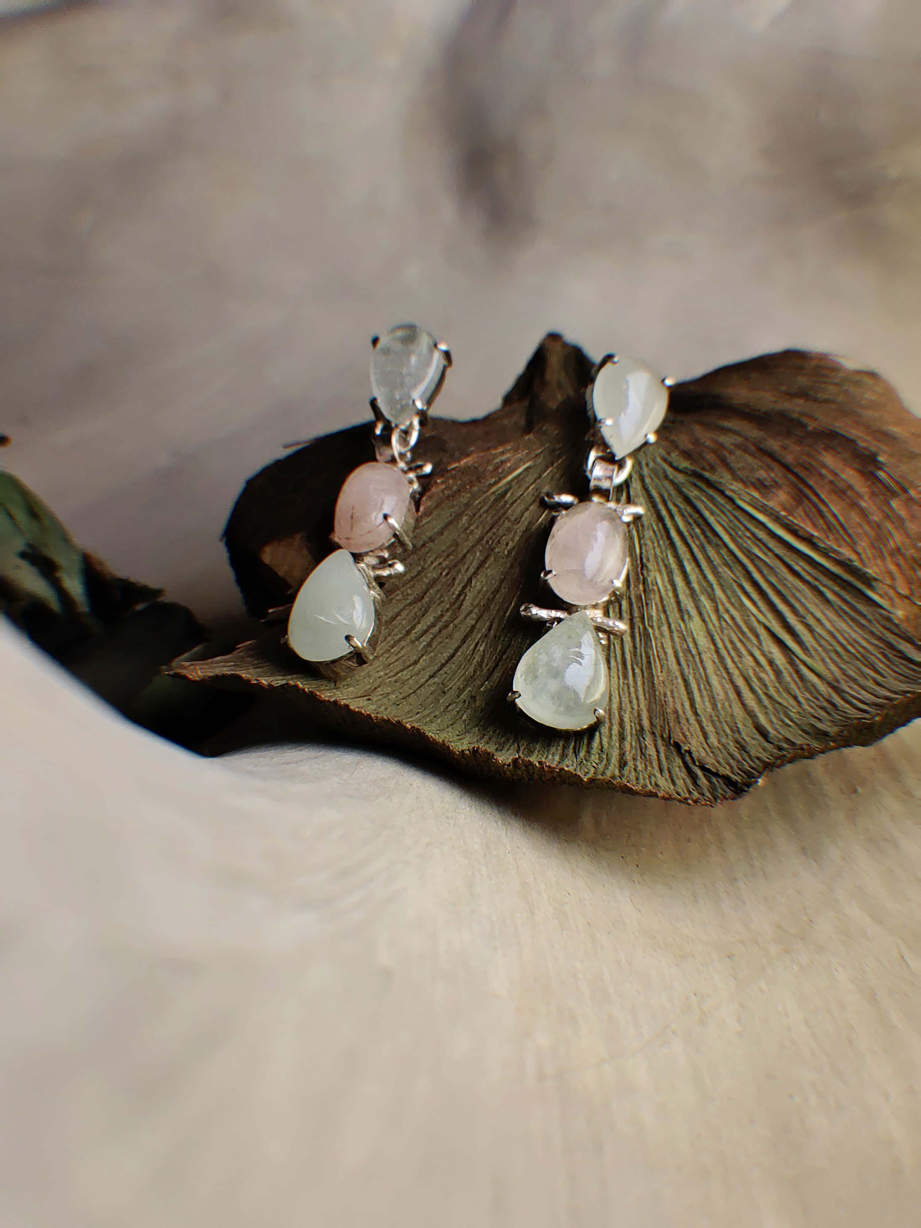Tulip: A handcrafted Earrings featuring Pearl  Zirconia and hues of White.