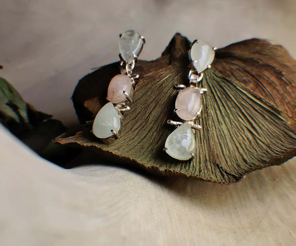 Tulip: A handcrafted Earrings featuring Pearl  Zirconia and hues of White.