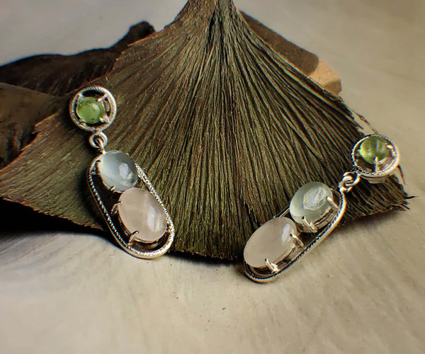Morning Mirage: A handcrafted Earrings featuring Aquamarine Quartz Peridot and hues of Blue Pink Green.