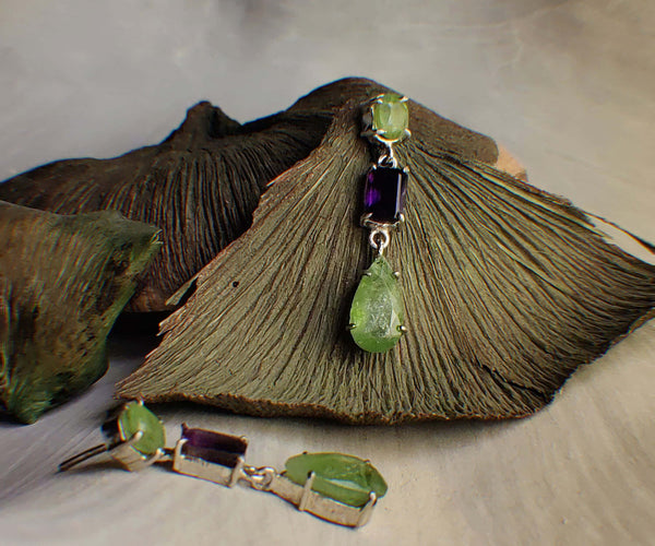 Fiza: A handcrafted Earrings featuring Peridot Amethyst and hues of Green Purple.