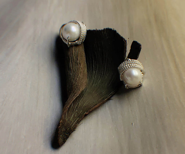 Selena: A handcrafted Earrings featuring Pearl and hues of White.
