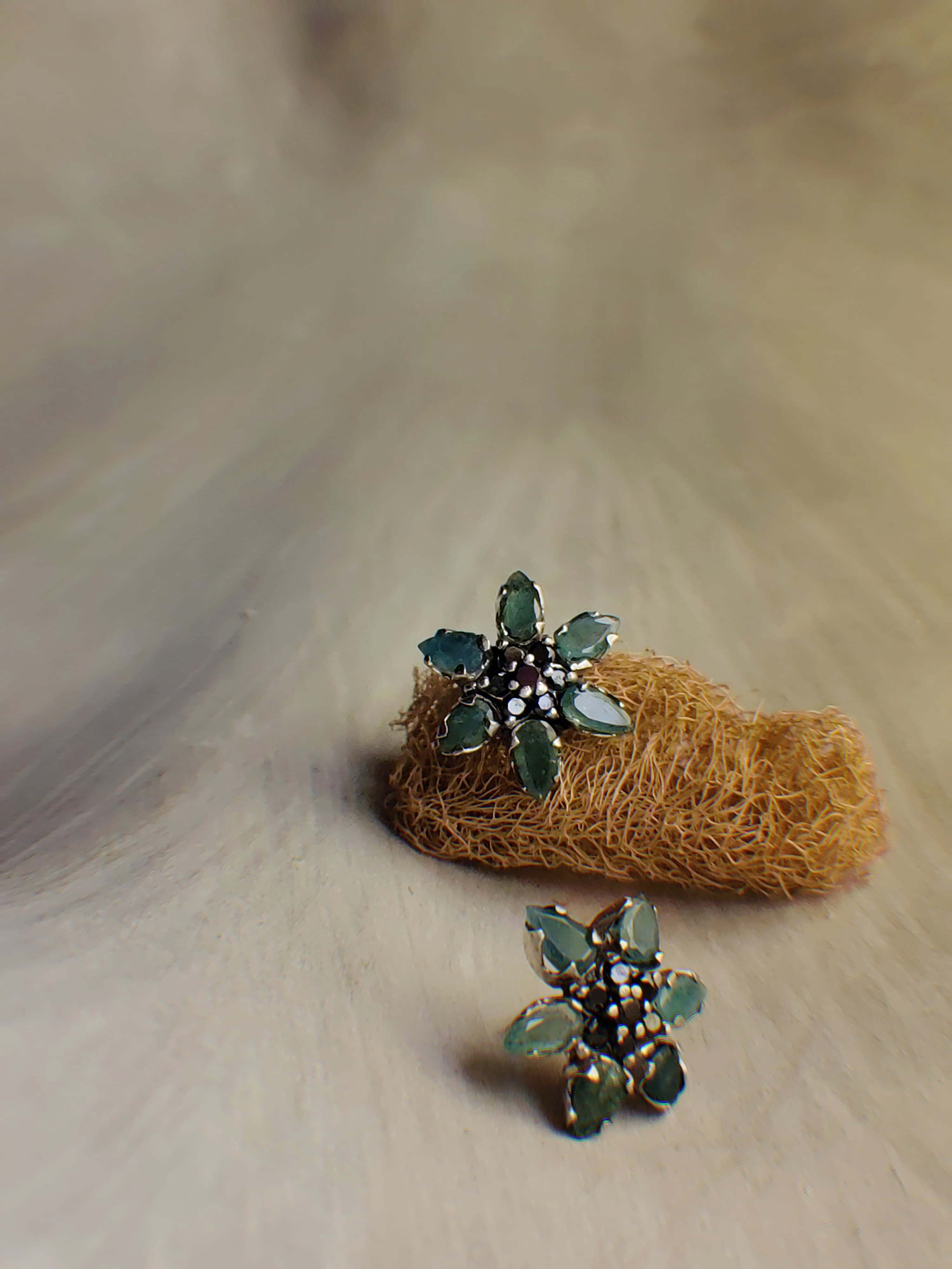 Pine: A handcrafted Earrings featuring Emerald  Zirconia and hues of Green Black.