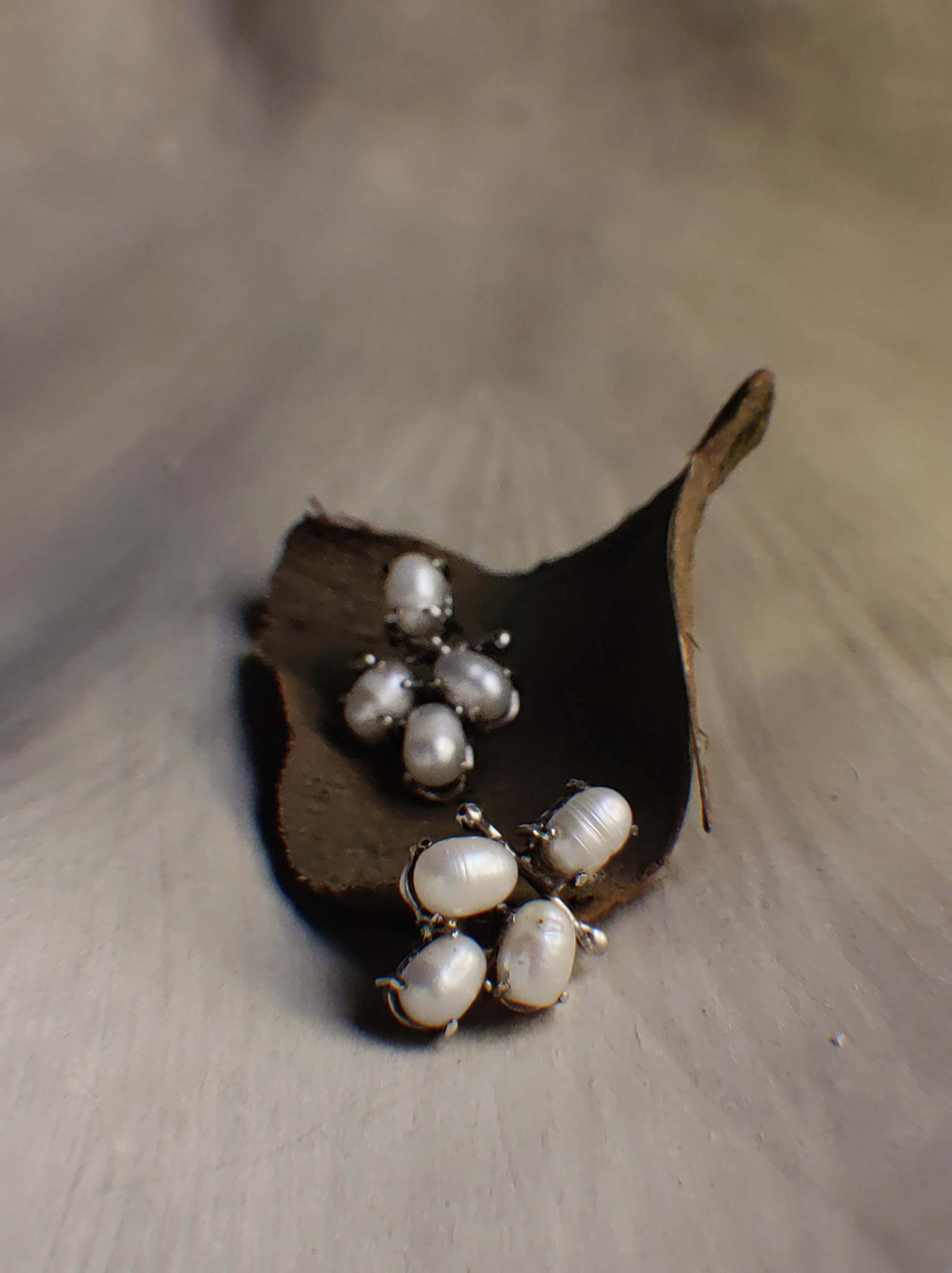 Cotton: A handcrafted Earrings featuring Pearl and hues of White.