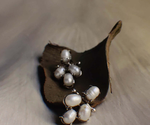 Cotton: A handcrafted Earrings featuring Pearl and hues of White.