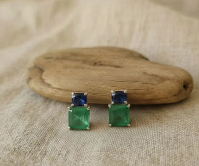 Silver Annum jewelry showing off Jade and Sapphire in blue and green.