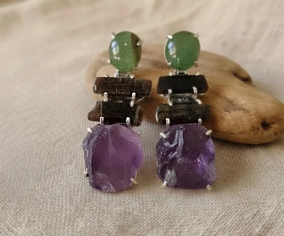 Elegant Lama silver pieces containing Peridot, Amethyst, and Tourmaline in green, purple, and blue.
