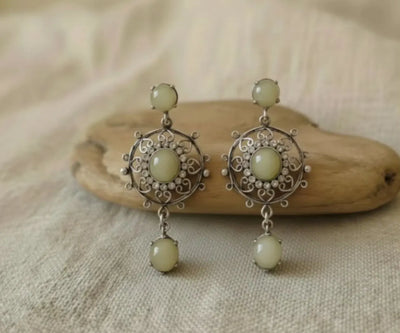 Silver Onaiza jewelry showing off Jade and Zirconia in green and white.