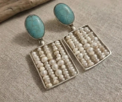 Zeen drop earrings highlighting Pearl and Turquoise in white and blue.