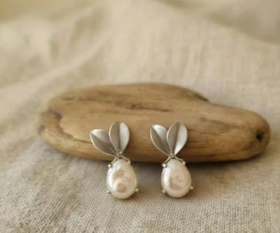 Sofia drop earrings highlighting Pearl in white.