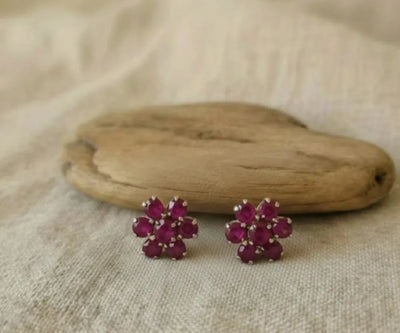 Silver Ramish jewelry showing off Ruby in red.