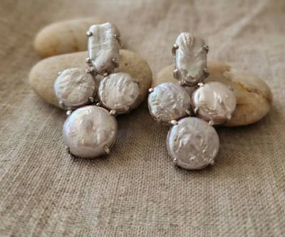 Handcrafted Reemy earrings boasting Pearl in white.