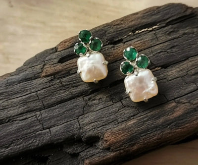 Sterling silver Hel earrings featuring Pearl and Emerald in white and green.