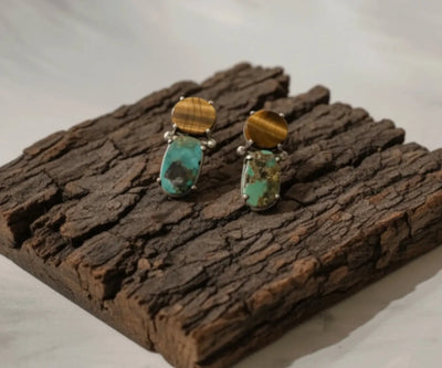 Zireh drop earrings highlighting Tiger Stone and Turquoise in blue and brown.