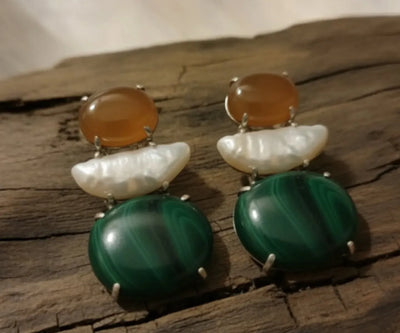 Silver Bay jewelry showing off Agate, Pearl, and Malachite in orange, white, and green.