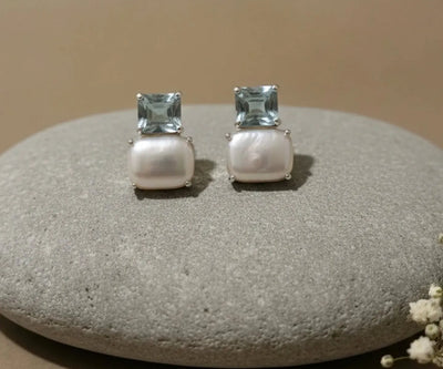 Refined Ocean earrings detailed with Aquamarine and Pearl in blue and white.