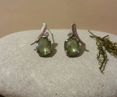 Amla drop earrings highlighting Peridot in green.
