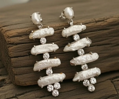 Beautiful Eira studs set with Pearl and Zirconia in white.