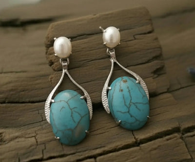 Silver Sima jewelry showing off Pearl and Turquoise in white and blue.