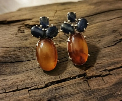 Handcrafted Zafran earrings boasting Agate and Sapphire in blue and orange.