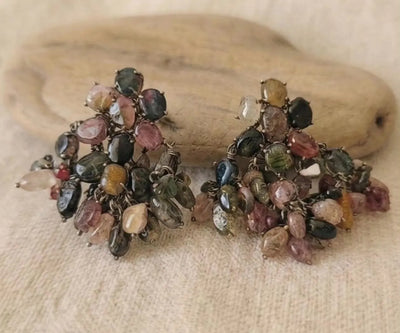 Elegant Tempest silver pieces containing Tourmaline in pink, green, and black.