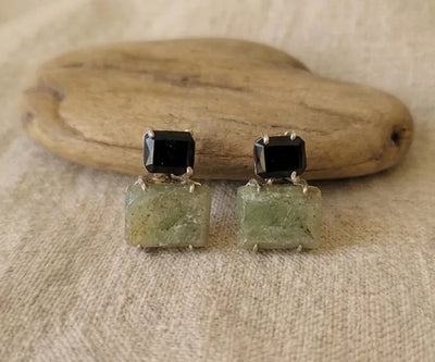 Silver Ferny jewelry showing off Peridot and Tourmaline in green and black.